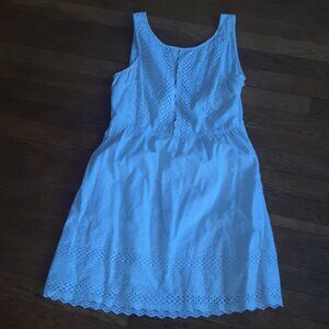 White mini eyelet dress with open back.